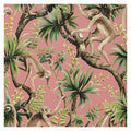Monkey Business wallpaper by Catherine Martin in coral, monkeys among green palms on a dusky pink ground, close-up swatch