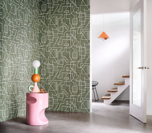 Alexander wallpaper by Casamance in olive green with fine white linework, styled in a hallway beside a pink sculptural plinth