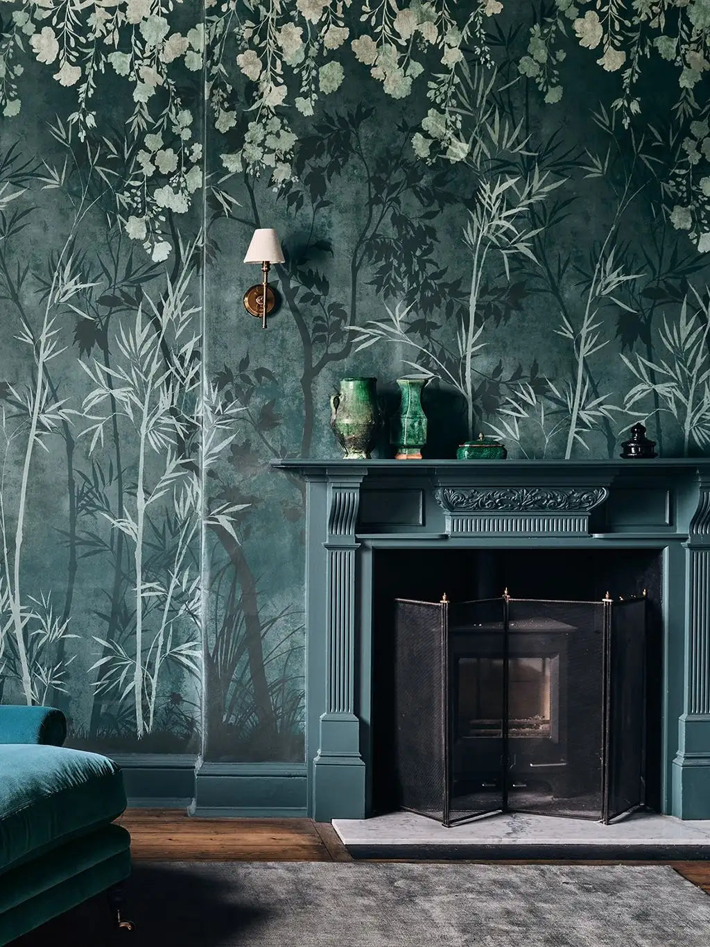 Sayuri wallpaper by Romo in Green - botanical design, fine stems on a deep green ground in a fireplace alcove