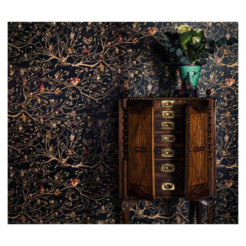 Harry Potter Black Family Tapestry wall mural in dark green styled behind an antique inlaid cabinet with roses