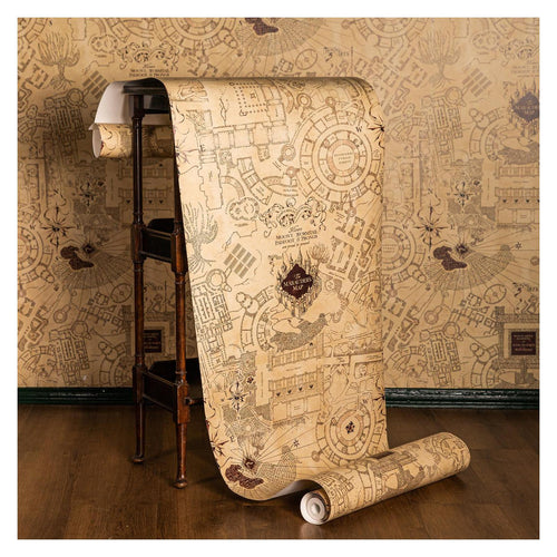 Harry Potter Marauder Map wall mural, parchment roll unfurled over a table against the hung map pattern