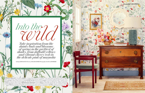 Ciao Bella White wallpaper by Wallpaper Trader featured in a magazine spread beside a styled chest and floral artwork