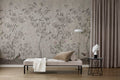 Chinoiserie Chic wallpaper by Rebel Walls in warm grey styled in a living room with a beige daybed