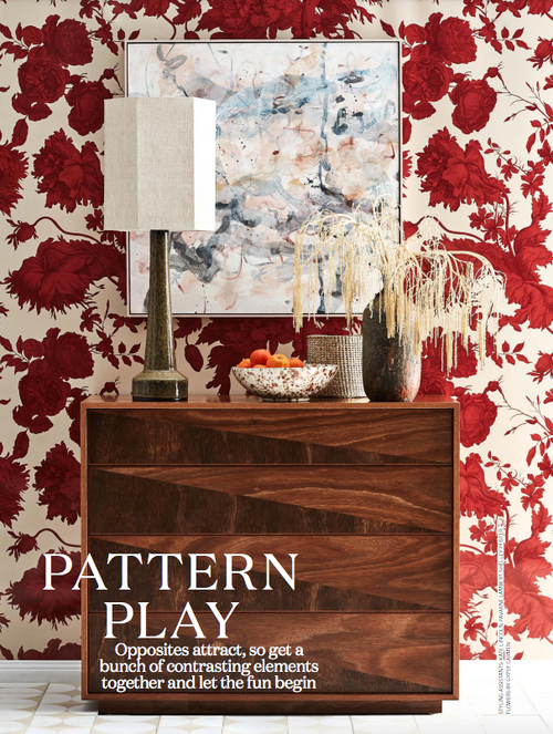 Rose e Fiore wallpaper by Wallpaper Trader styled behind a wooden console with red floral pattern in a magazine-style room