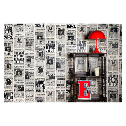 Daily Prophet newspaper wall mural styled on a wall behind a shelf with a red lamp and red letter E decoration