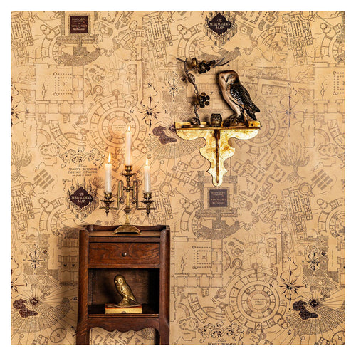 Harry Potter Marauder Map wall mural by MinaLima in aged parchment tones, styled with an owl shelf and candelabra